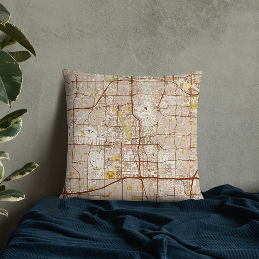 Custom Addison Texas Map Throw Pillow in Woodblock on Bedding Against Wall
