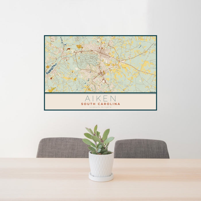 24x36 Aiken South Carolina Map Print Lanscape Orientation in Woodblock Style Behind 2 Chairs Table and Potted Plant