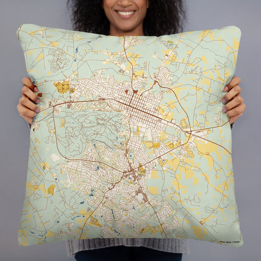 Person holding 22x22 Custom Aiken South Carolina Map Throw Pillow in Woodblock