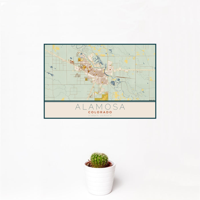 12x18 Alamosa Colorado Map Print Landscape Orientation in Woodblock Style With Small Cactus Plant in White Planter