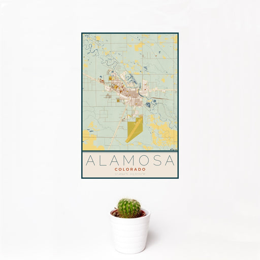 12x18 Alamosa Colorado Map Print Portrait Orientation in Woodblock Style With Small Cactus Plant in White Planter