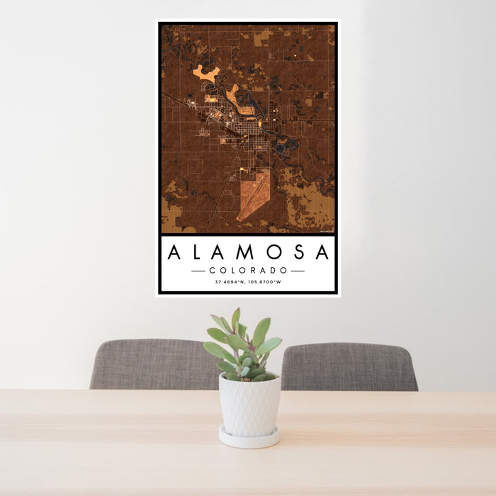 24x36 Alamosa Colorado Map Print Portrait Orientation in Ember Style Behind 2 Chairs Table and Potted Plant