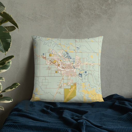 Custom Alamosa Colorado Map Throw Pillow in Woodblock on Bedding Against Wall