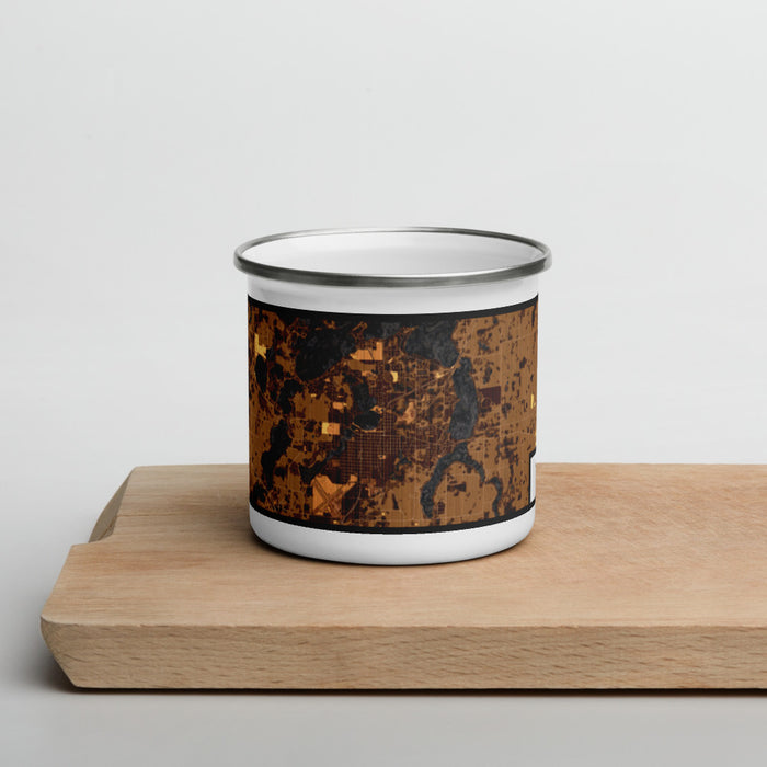 Front View Custom Alexandria Minnesota Map Enamel Mug in Ember on Cutting Board