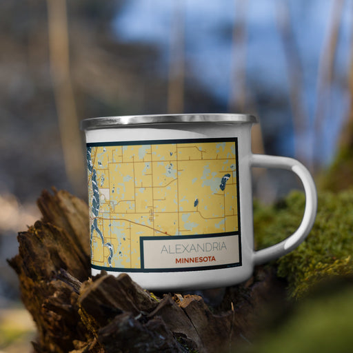 Right View Custom Alexandria Minnesota Map Enamel Mug in Woodblock on Grass With Trees in Background