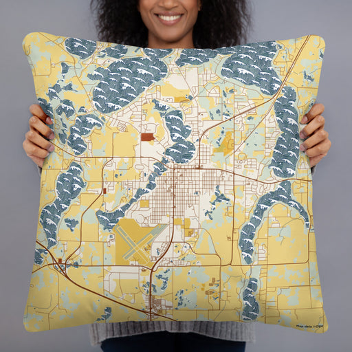 Person holding 22x22 Custom Alexandria Minnesota Map Throw Pillow in Woodblock