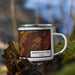 Right View Custom American Falls Idaho Map Enamel Mug in Ember on Grass With Trees in Background