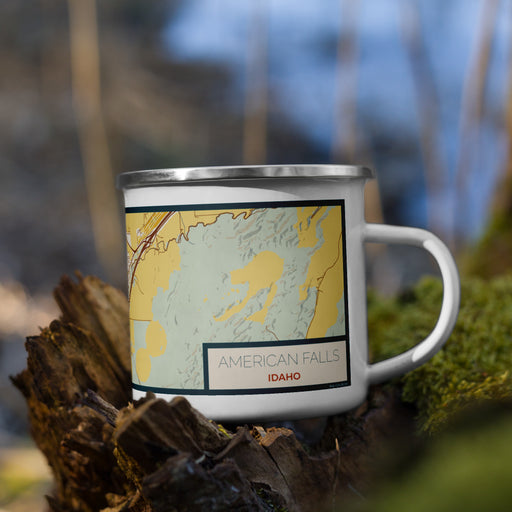 Right View Custom American Falls Idaho Map Enamel Mug in Woodblock on Grass With Trees in Background