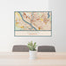 24x36 Anoka Minnesota Map Print Lanscape Orientation in Woodblock Style Behind 2 Chairs Table and Potted Plant