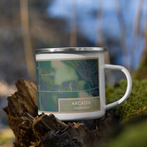 Right View Custom Arcadia Nebraska Map Enamel Mug in Afternoon on Grass With Trees in Background