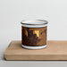 Front View Custom Arcadia Nebraska Map Enamel Mug in Ember on Cutting Board