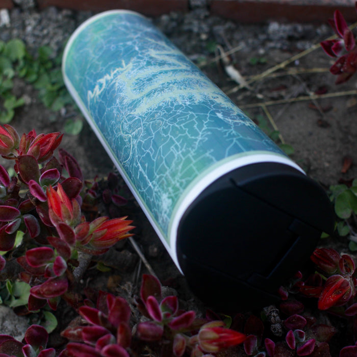 17oz Stainless Steel Insulated Tumbler in White with Custom Afternoon Style Lying on Ground Next to Flowers