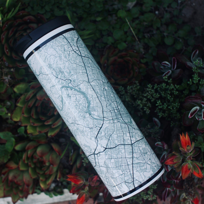 17oz Stainless Steel Insulated Tumbler in White with Custom Claissc Style Map on Bed of Flowers