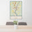 24x36 Augusta Maine Map Print Portrait Orientation in Woodblock Style Behind 2 Chairs Table and Potted Plant