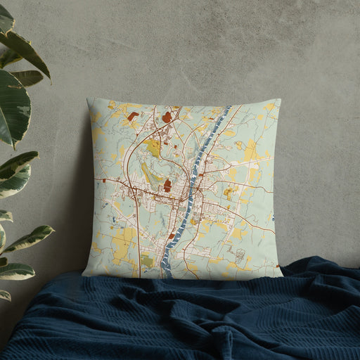 Custom Augusta Maine Map Throw Pillow in Woodblock on Bedding Against Wall