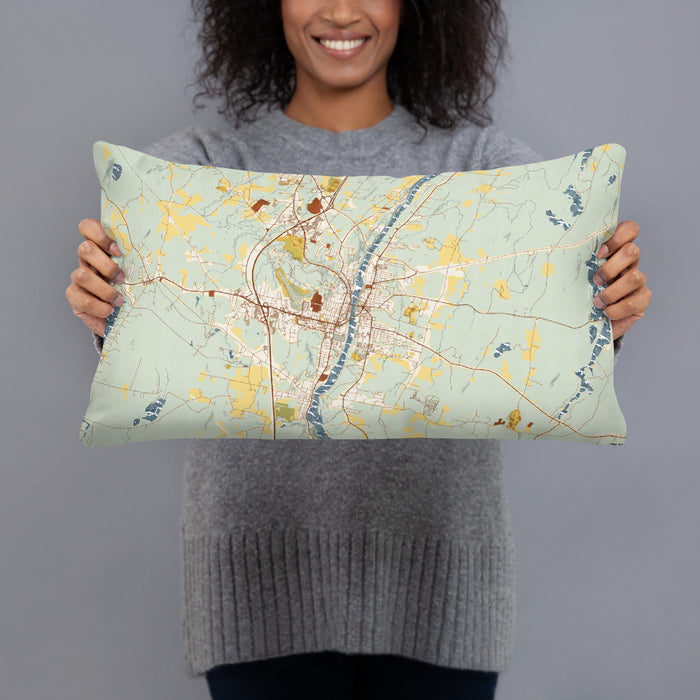Person holding 20x12 Custom Augusta Maine Map Throw Pillow in Woodblock