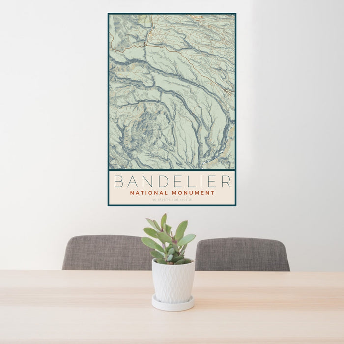 24x36 Bandelier National Monument Map Print Portrait Orientation in Woodblock Style Behind 2 Chairs Table and Potted Plant