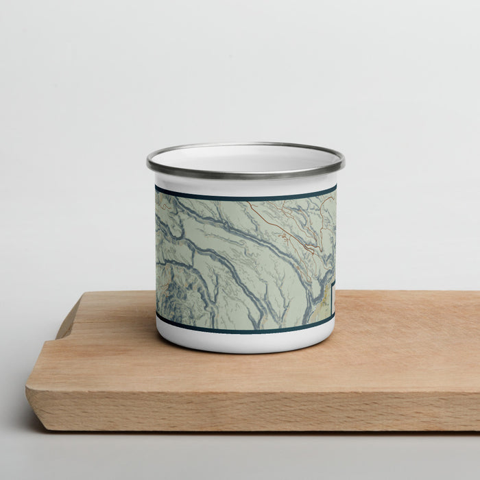 Front View Custom Bandelier National Monument Map Enamel Mug in Woodblock on Cutting Board