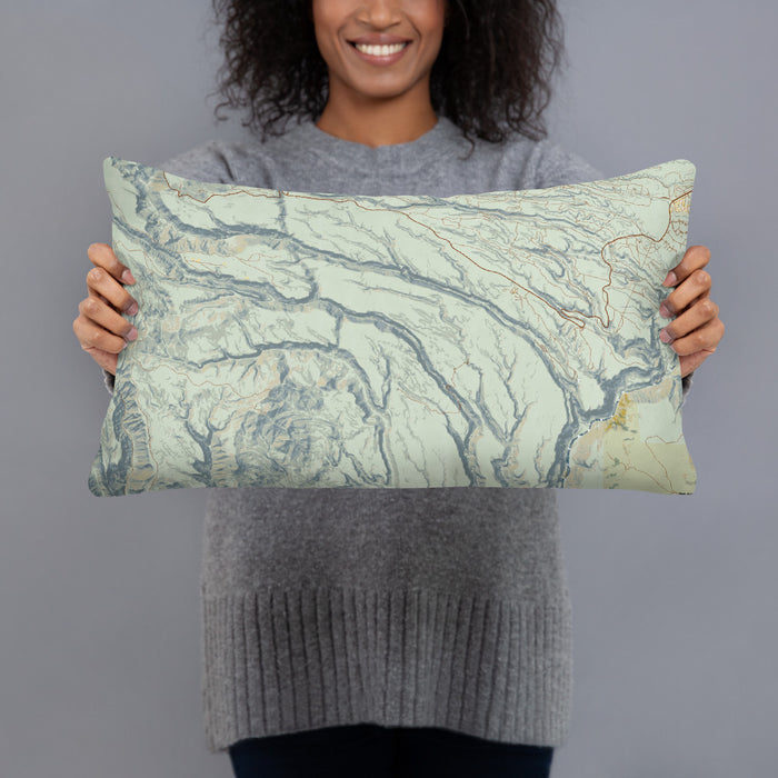 Person holding 20x12 Custom Bandelier National Monument Map Throw Pillow in Woodblock