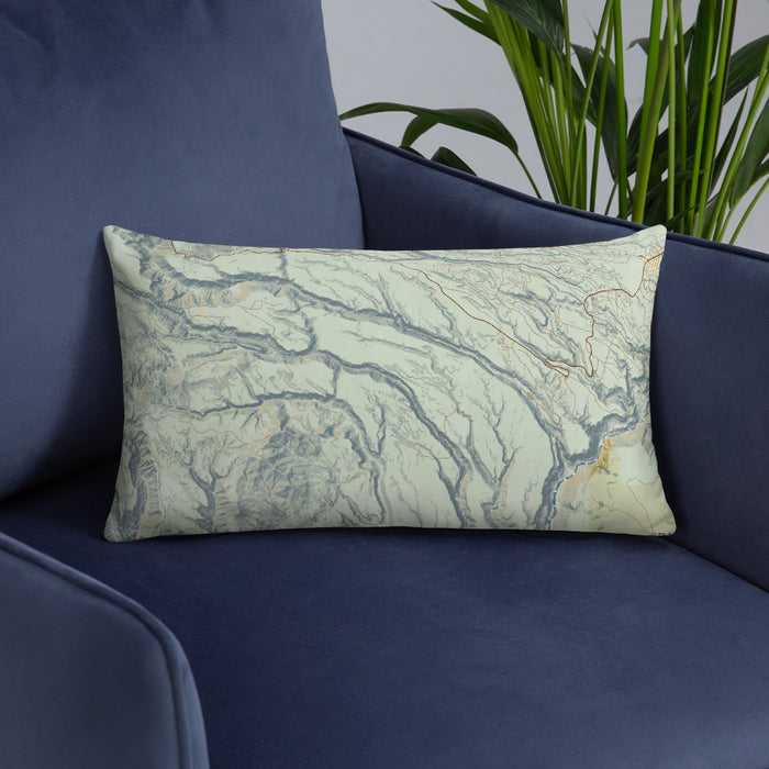 Custom Bandelier National Monument Map Throw Pillow in Woodblock on Blue Colored Chair