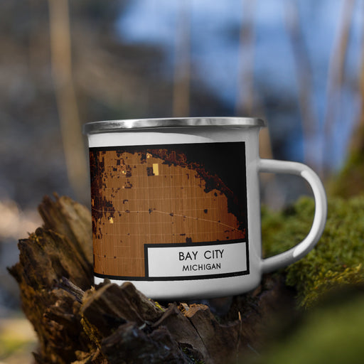 Right View Custom Bay City Michigan Map Enamel Mug in Ember on Grass With Trees in Background