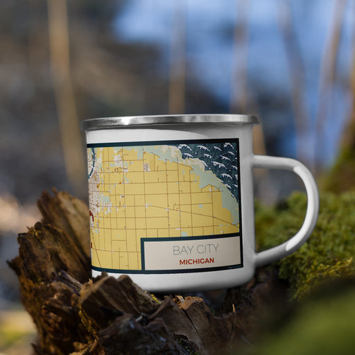 Right View Custom Bay City Michigan Map Enamel Mug in Woodblock on Grass With Trees in Background