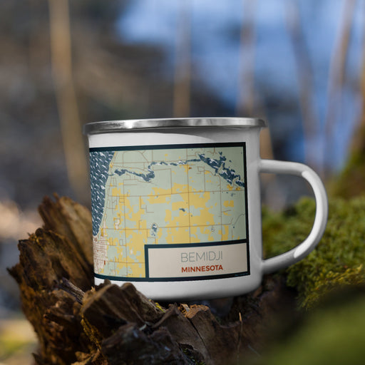 Right View Custom Bemidji Minnesota Map Enamel Mug in Woodblock on Grass With Trees in Background