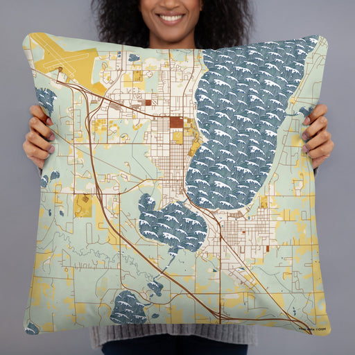 Person holding 22x22 Custom Bemidji Minnesota Map Throw Pillow in Woodblock