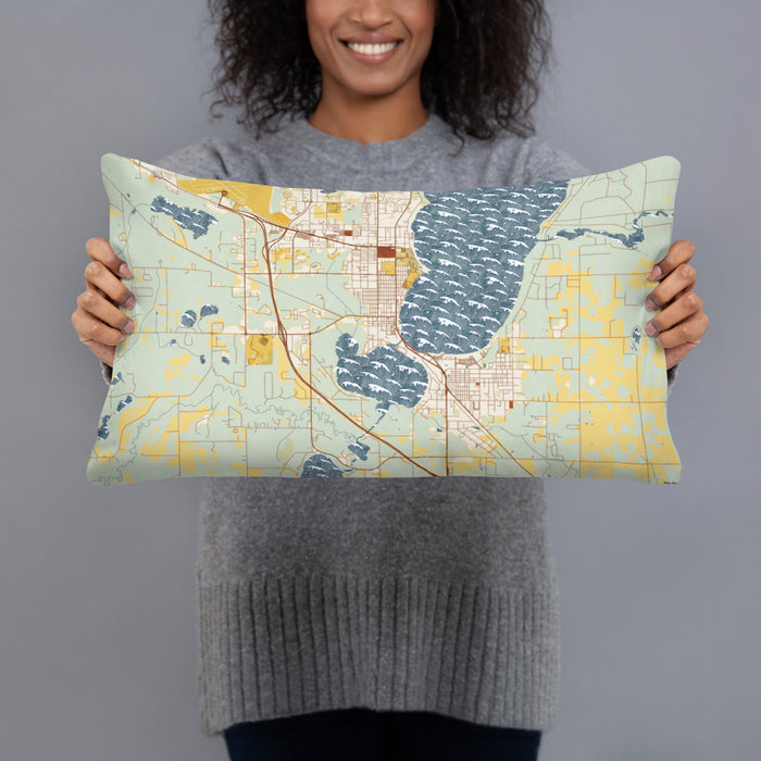 Person holding 20x12 Custom Bemidji Minnesota Map Throw Pillow in Woodblock