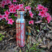 20oz Stainless Steel Insulated Bottle with Bamboo Top with red map next to pink flowers