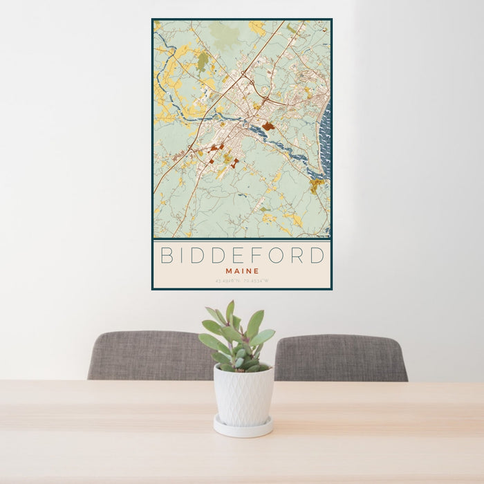 24x36 Biddeford Maine Map Print Portrait Orientation in Woodblock Style Behind 2 Chairs Table and Potted Plant