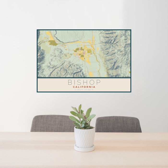 24x36 Bishop California Map Print Lanscape Orientation in Woodblock Style Behind 2 Chairs Table and Potted Plant