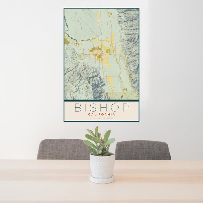 24x36 Bishop California Map Print Portrait Orientation in Woodblock Style Behind 2 Chairs Table and Potted Plant