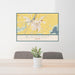 24x36 Blackfoot Idaho Map Print Lanscape Orientation in Woodblock Style Behind 2 Chairs Table and Potted Plant