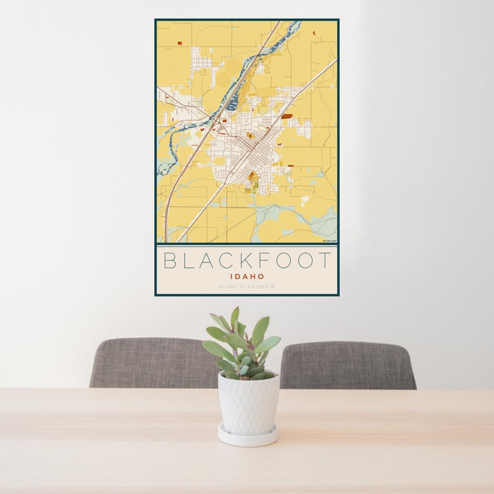 24x36 Blackfoot Idaho Map Print Portrait Orientation in Woodblock Style Behind 2 Chairs Table and Potted Plant