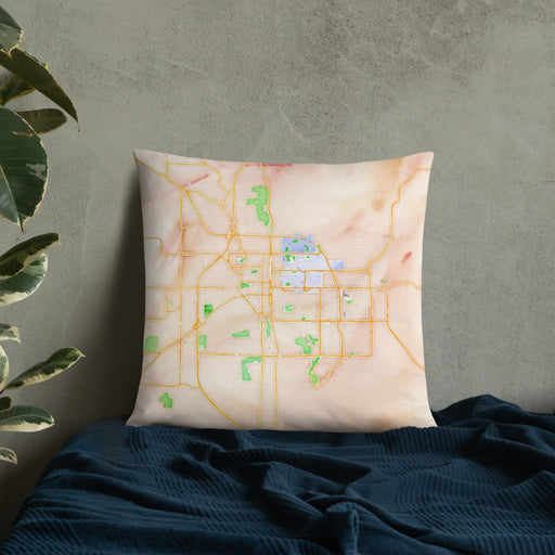 Custom Bloomington Indiana Map Throw Pillow in Watercolor on Bedding Against Wall