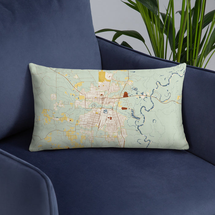 Custom Bogalusa Louisiana Map Throw Pillow in Woodblock on Blue Colored Chair