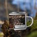 Right View Custom Boulder Lake Wyoming Map Enamel Mug in Ember on Grass With Trees in Background