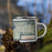 Right View Custom Boulder Lake Wyoming Map Enamel Mug in Woodblock on Grass With Trees in Background