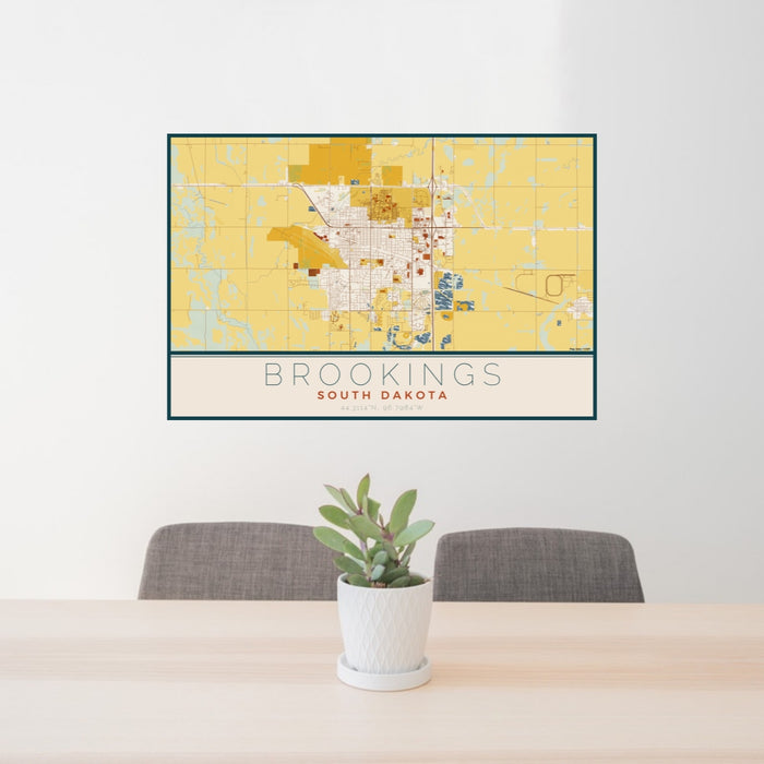 24x36 Brookings South Dakota Map Print Lanscape Orientation in Woodblock Style Behind 2 Chairs Table and Potted Plant