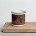 Front View Custom Burlington Kansas Map Enamel Mug in Ember on Cutting Board