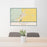 24x36 Burns Oregon Map Print Lanscape Orientation in Woodblock Style Behind 2 Chairs Table and Potted Plant