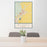 24x36 Burns Oregon Map Print Portrait Orientation in Woodblock Style Behind 2 Chairs Table and Potted Plant