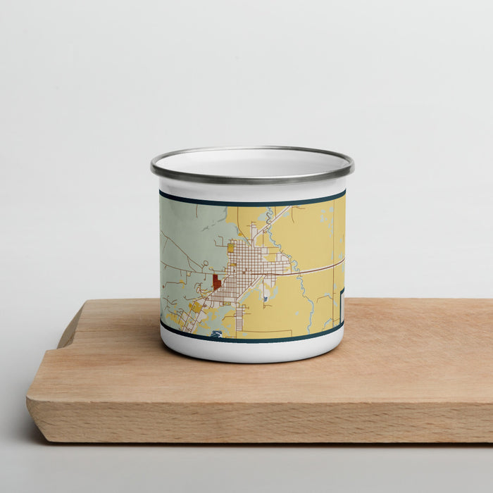 Front View Custom Burns Oregon Map Enamel Mug in Woodblock on Cutting Board