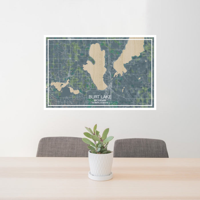 24x36 Burt Lake Michigan Map Print Landscape Orientation in Afternoon Style Behind 2 Chairs Table and Potted Plant