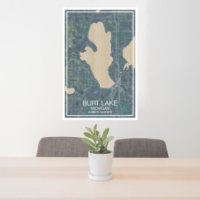 24x36 Burt Lake Michigan Map Print Portrait Orientation in Afternoon Style Behind 2 Chairs Table and Potted Plant