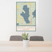 24x36 Burt Lake Michigan Map Print Portrait Orientation in Woodblock Style Behind 2 Chairs Table and Potted Plant
