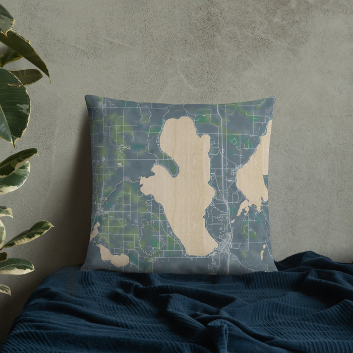 Custom Burt Lake Michigan Map Throw Pillow in Afternoon on Bedding Against Wall