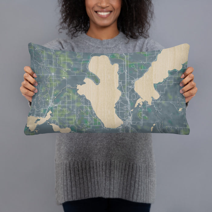 Person holding 20x12 Custom Burt Lake Michigan Map Throw Pillow in Afternoon
