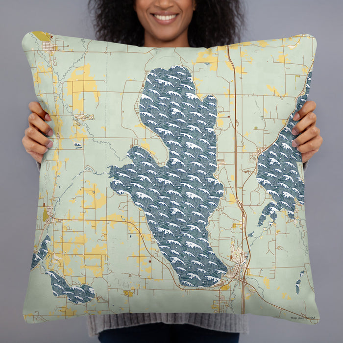 Person holding 22x22 Custom Burt Lake Michigan Map Throw Pillow in Woodblock